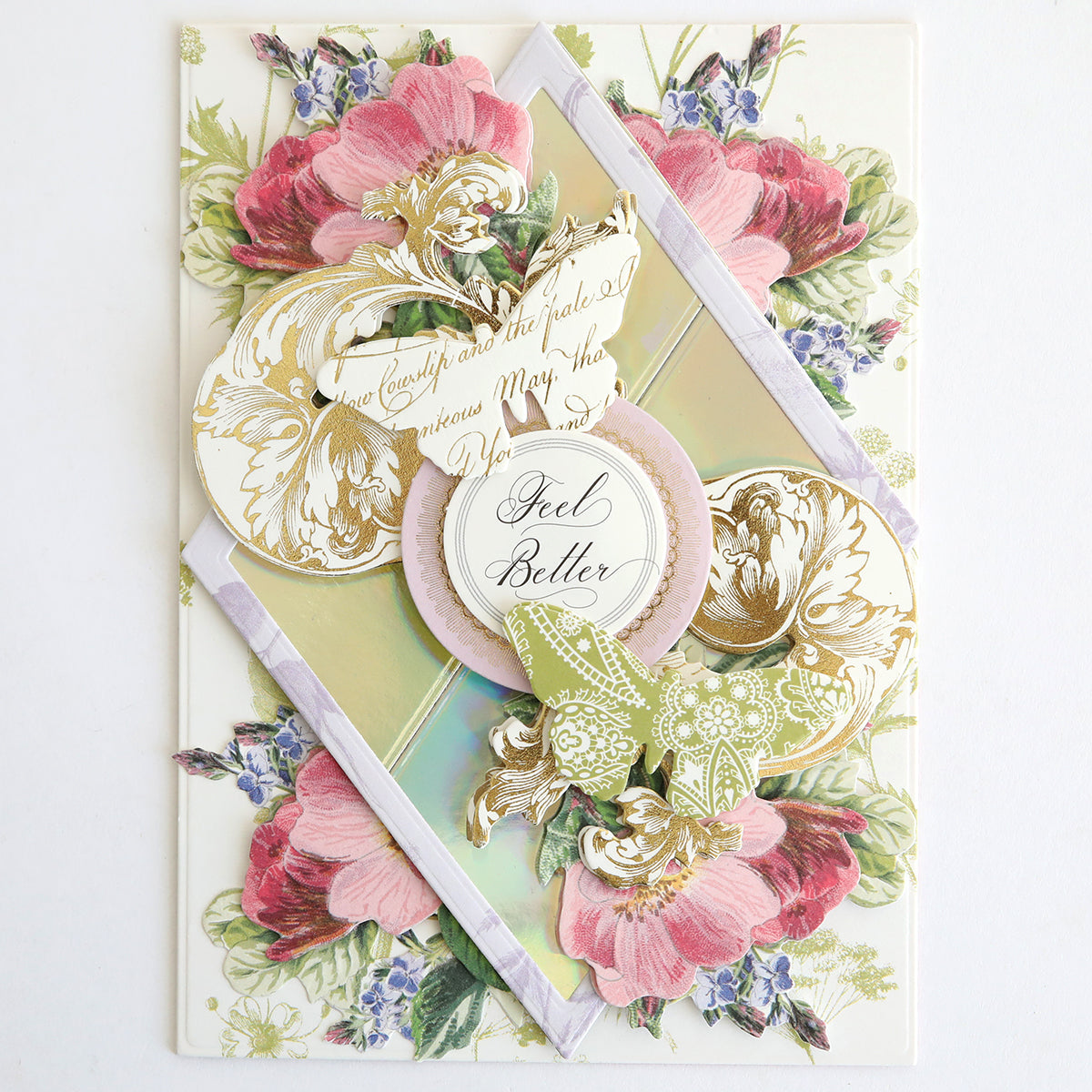 A "Get Well" card featuring layered paper flowers, butterflies, and an ornate "Feel Better" message, all crafted on Luxury Iridescent Foil Cardstock for a premium feel with shimmering silver accents.