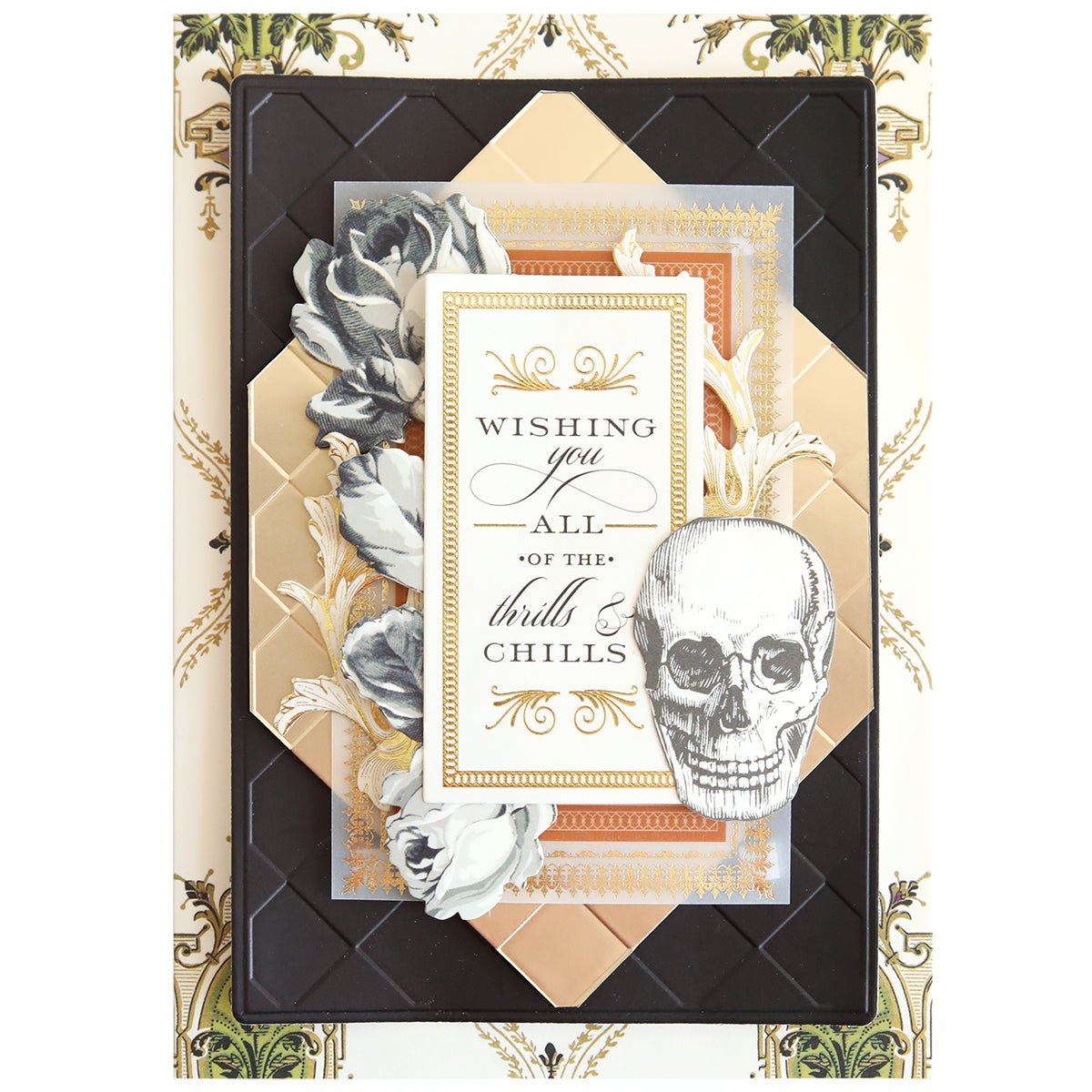 Handmade greeting card featuring gold and black geometric layers, floral accents, a skull illustration, and “Wishing you all of the thrills & chills.” Crafted using Spellbound Patterns Cut & Emboss Folders—ideal for seasonal projects.
