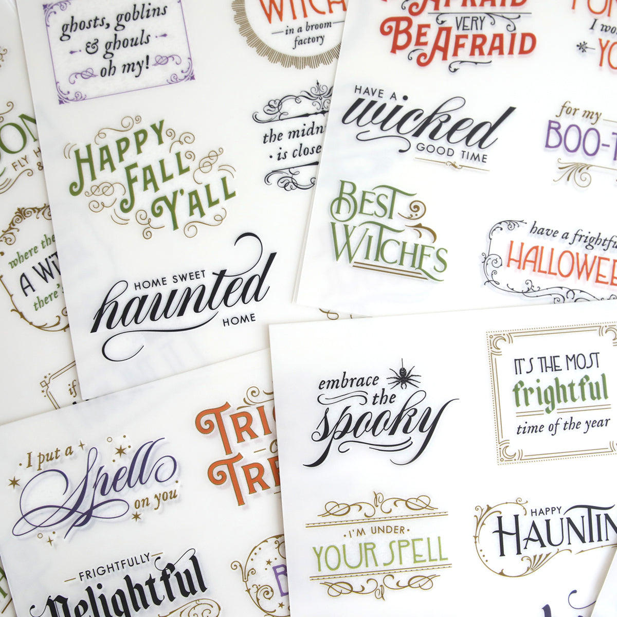 Spellbound Sentiment Rub On Transfers feature Halloween phrases like "Home Sweet Haunted Home" and "Best Witches" in assorted fonts—perfect for Fall crafts or adding a spooky touch to your décor.