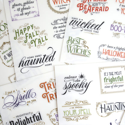 Spellbound Sentiment Rub On Transfers feature Halloween phrases like "Home Sweet Haunted Home" and "Best Witches" in assorted fonts—perfect for Fall crafts or adding a spooky touch to your décor.