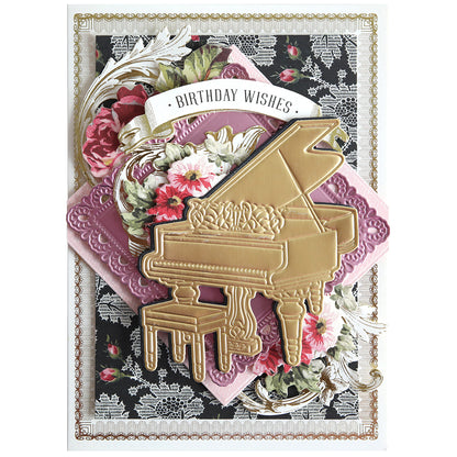 The Music 3D Scene Dies create a decorative birthday card with a gold grand piano, flowers, a "Birthday Wishes" banner, and lace floral background—ideal for anyone who loves elegant, music-inspired card designs.