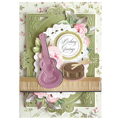 The Music 3D Scene Dies create a decorative birthday card with a pink guitar, gold drum, floral patterns, and "Birthday Greetings" text for an elegant musical touch.