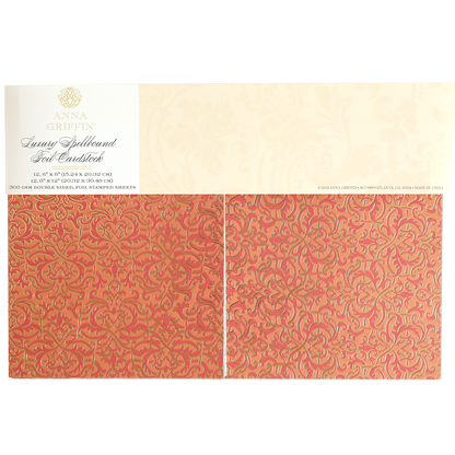 The Luxury Spellbound Foil Cardstock features 30 double-sided orange and gold ornate foil sheets, 12" x 12", adding a luxurious touch to your crafting projects.