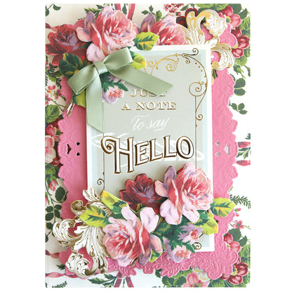Antique Greetings Postcard Embellishment Stickers feature floral designs, a green ribbon bow, and gold-embossed "Just a note to say Hello" text on a pink and white background—ideal for vintage postcard fans and unique scrapbooking projects.