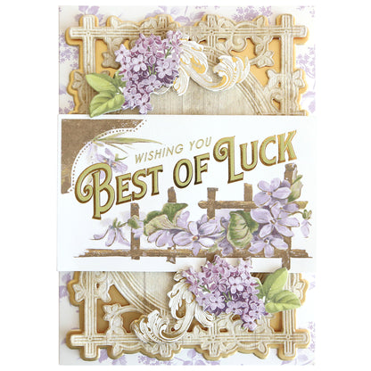 Antique Greetings Postcard Embellishment Stickers feature ornate gold borders, purple flowers, and "Wishing You Best of Luck" in bold gold—ideal for vintage postcard fans or elegant scrapbook projects.