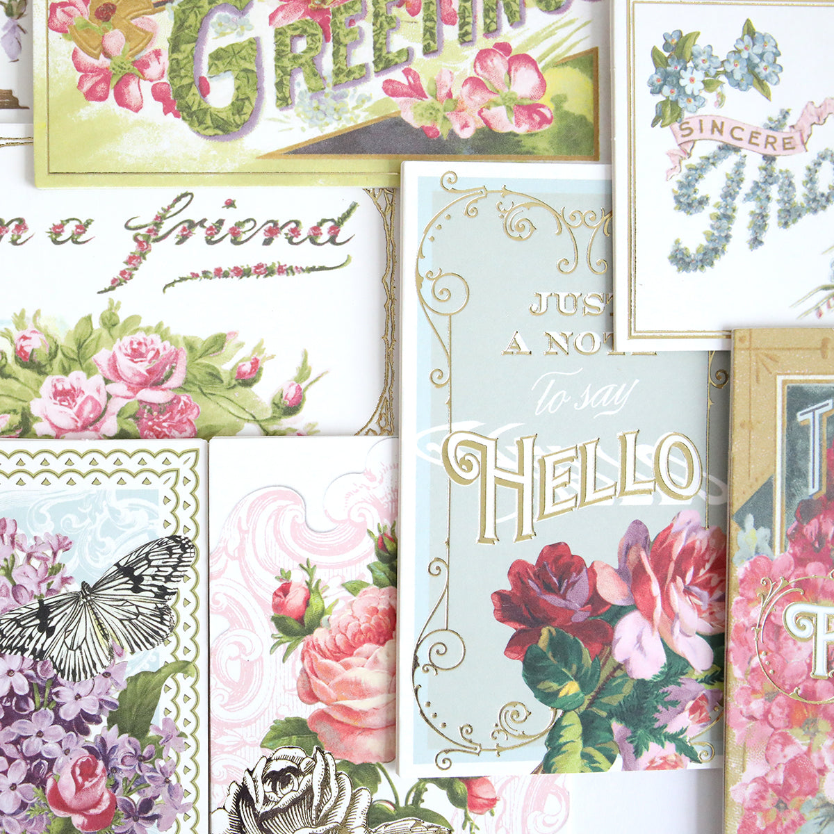 Antique Greetings Postcard Embellishment Stickers feature vintage floral patterns, butterflies, and greetings like "Hello" and "Sincere," ideal for scrapbooking and creative projects.