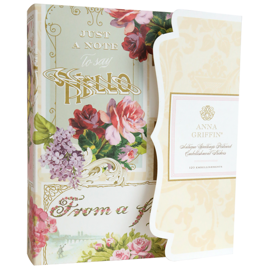 The Antique Greetings Postcard Embellishment Stickers come in a decorative floral box with gold "Just a Note to Say Hello" and "Anna Griffin" text, featuring assorted 3D embellishments and vintage postcards for your scrapbooking needs.