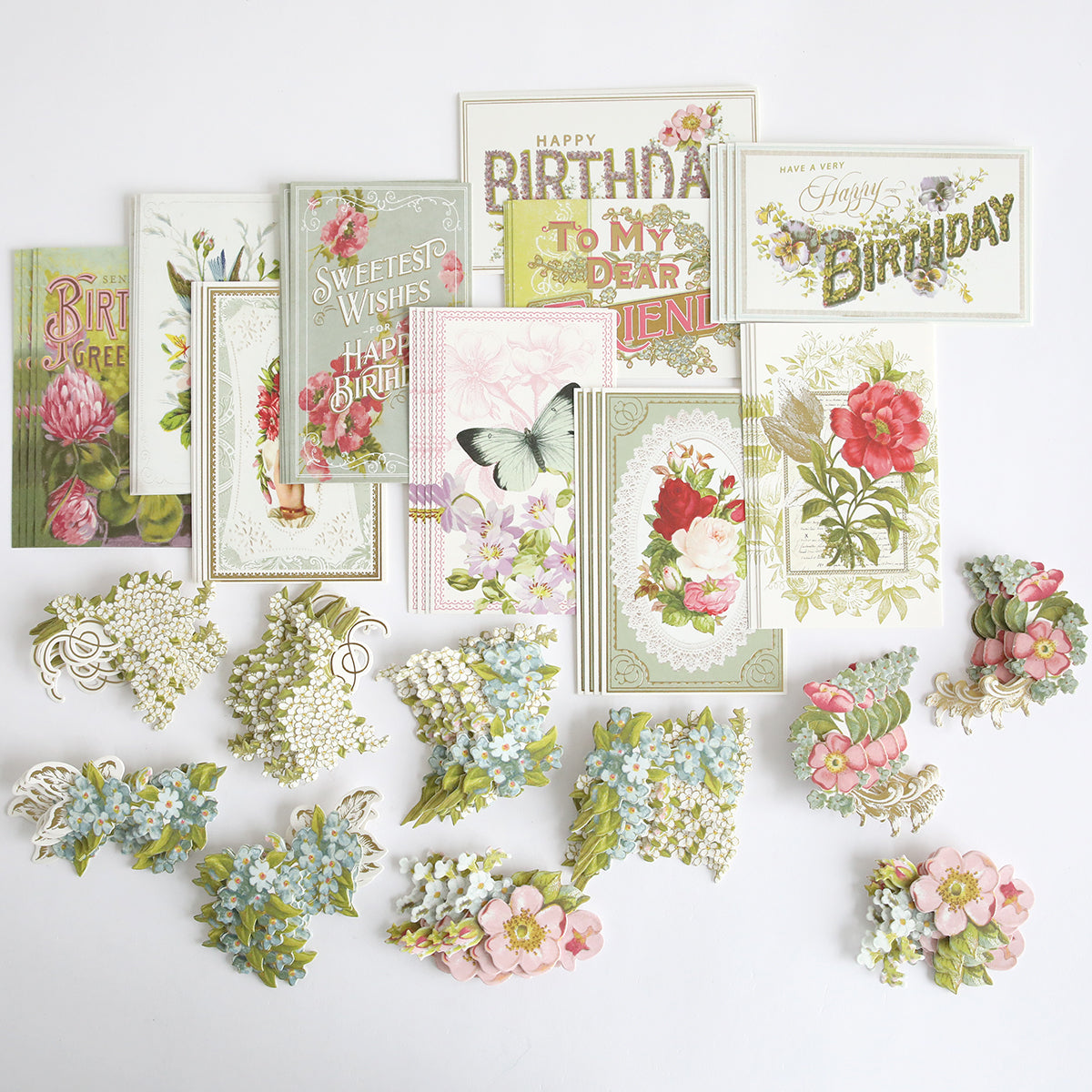 A set of vintage-style floral birthday cards and Antique Birthday Postcard Embellishment Stickers, plus decorative flower accents, displayed on a white surface.
