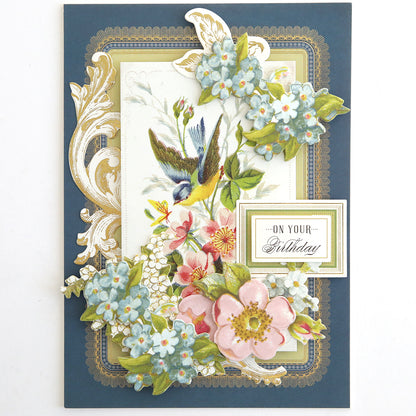 A decorative birthday card with a bird, flowers, and gold details reading "On Your Birthday"—perfect for pairing with Antique Birthday Postcard Embellishment Stickers or as a charming vintage sticker accent.