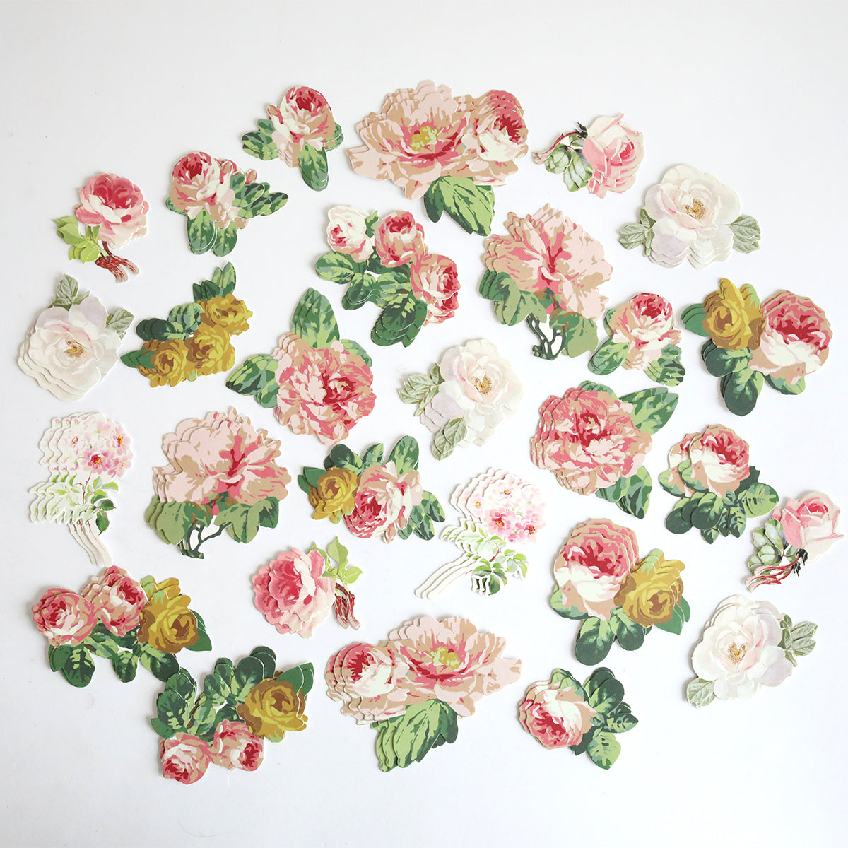 Virginia Die Cut Embellishments feature assorted cut-out roses in pink, white, and yellow with green leaves on a white background, ideal as floral stickers for scrapbooks.