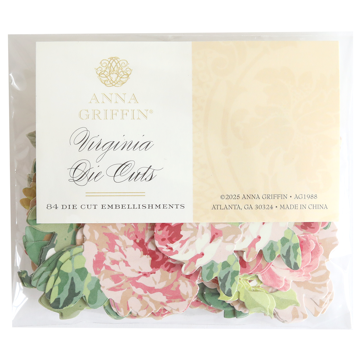 A clear package labeled "Virginia Die Cut Embellishments" contains 84 floral stickers in pink and green patterns, ideal for use as scrapbook embellishments.