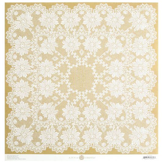 An intricate lace doily featuring a symmetrical floral pattern, designed by Anna Griffin, displayed on a beige background. Available as part of the Endora Kraft Lace 12x12 Cardstock pack containing 5 sheets of patterned cardstock, each measuring 12″ x 12″.