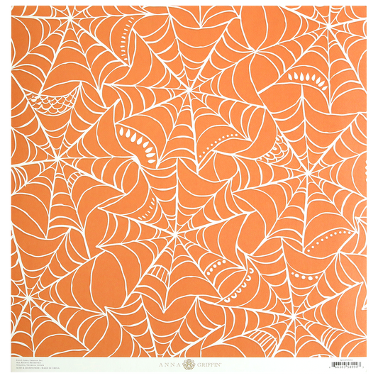 Endora Orange Web 12x12 Cardstock features an orange background patterned with white spider web designs, available in a single-sided pack of 5 sheets.