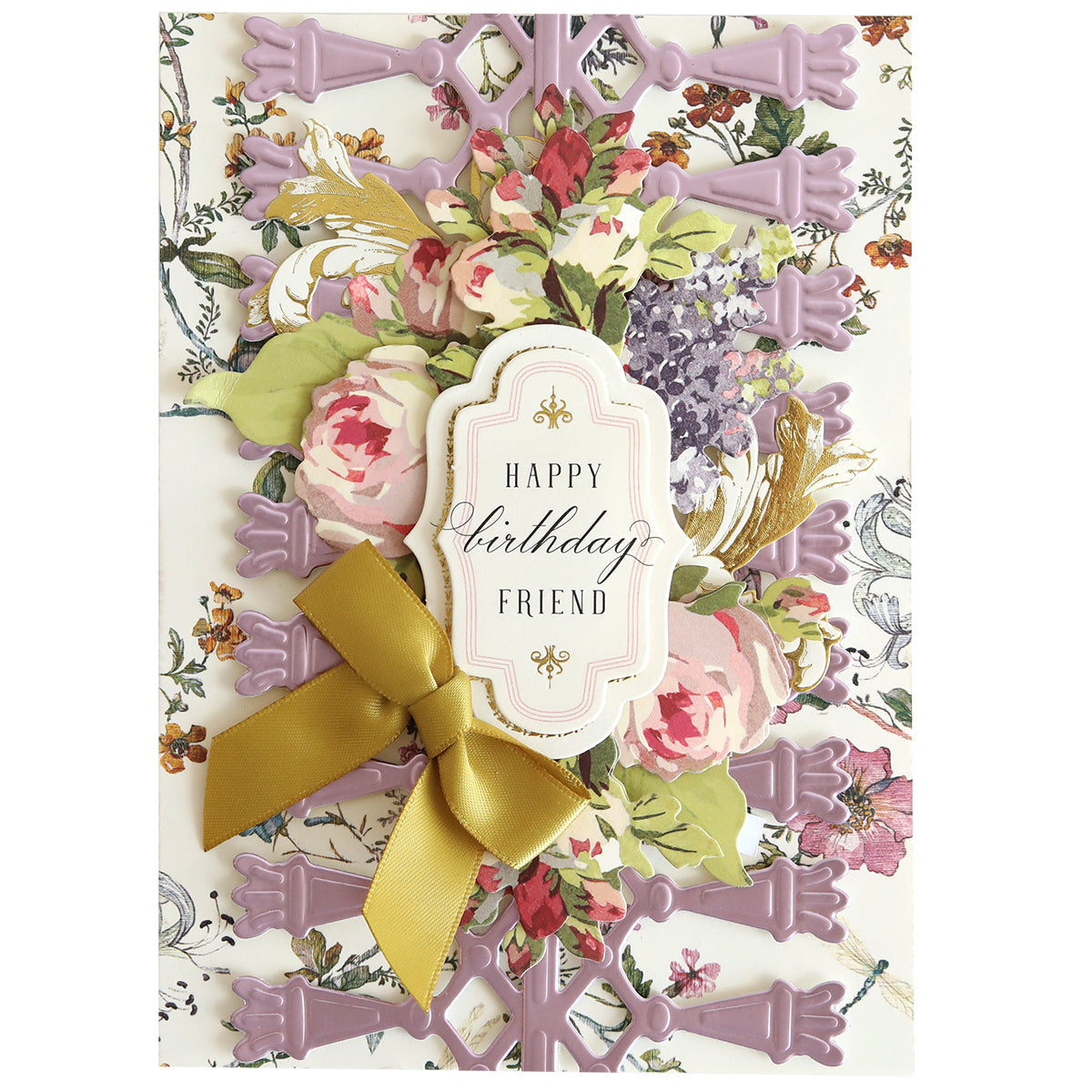 A decorative birthday card crafted with 12″ Regal Trimmings Border Dies and Rose Gold Matte Foil Cardstock, adorned with intricate floral patterns, a gold ribbon bow, and a label reading “Happy birthday friend” in elegant script.
