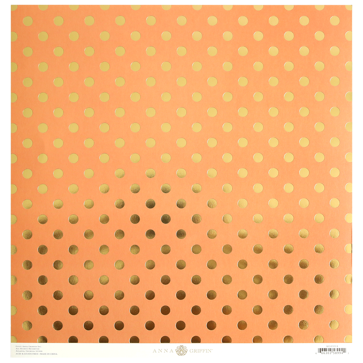 The Endora Orange/Gold 12x12 Cardstock comes in a pack of 5 sheets, each featuring a peach background with a gold polka dot pattern that gradually increases in size toward the bottom. This foil-stamped cardstock also includes branding and other text printed near the lower edge.