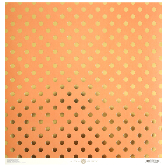 The Endora Orange/Gold 12x12 Cardstock comes in a pack of 5 sheets, each featuring a peach background with a gold polka dot pattern that gradually increases in size toward the bottom. This foil-stamped cardstock also includes branding and other text printed near the lower edge.