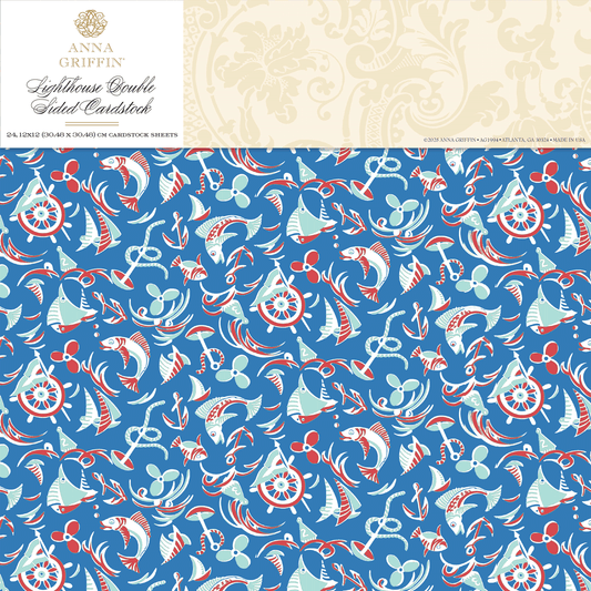 Lighthouse 12x12 Cardstock features blue patterned paper with white and red nautical illustrations like anchors, sailboats, lifesavers, and ropes. Anna Griffin branding at the top. Ideal for use with Lighthouse Easel Dies.
