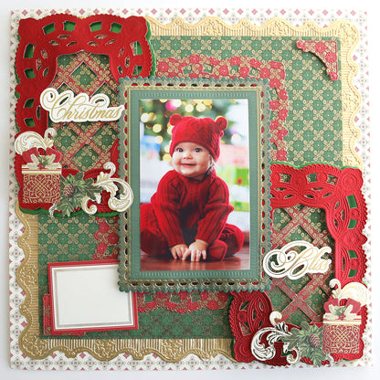 Scrapbook page with a baby in red, festive "Christmas" and "Bliss" accents, and ornate red, green, and gold decorations crafted from the Jasmine Holiday Cardstock Collection and 300 gsm cardstock.
