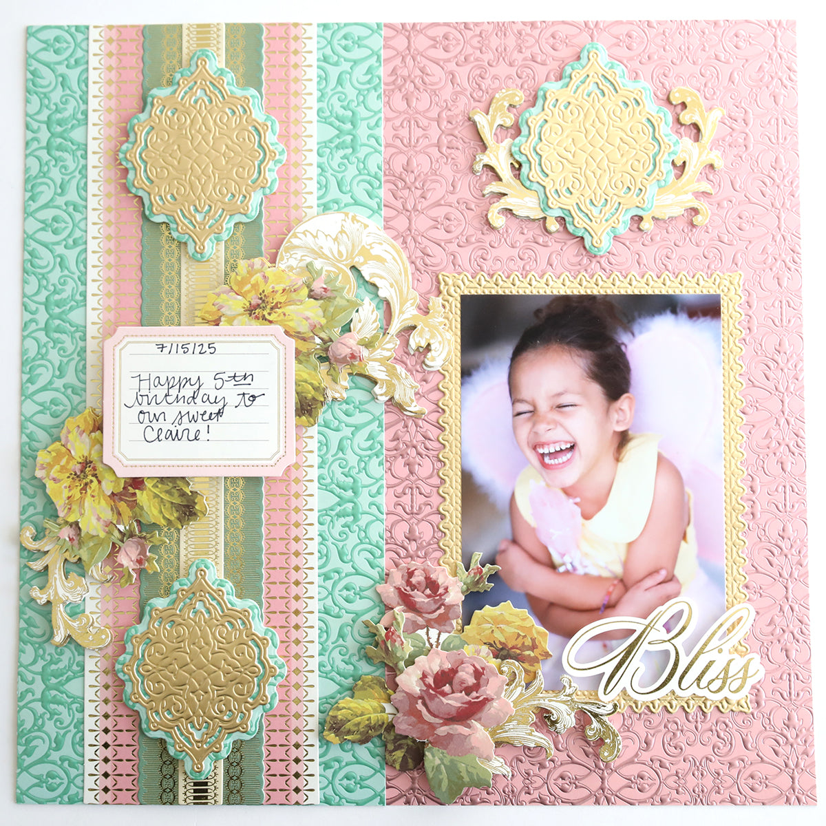 A scrapbook page featuring a laughing girl, floral embellishments, and "Bliss" in gold script, decorated with ornate pink, green, and gold accents using Jasmine Luxury Tonal Foil Cardstock for an elegant look.