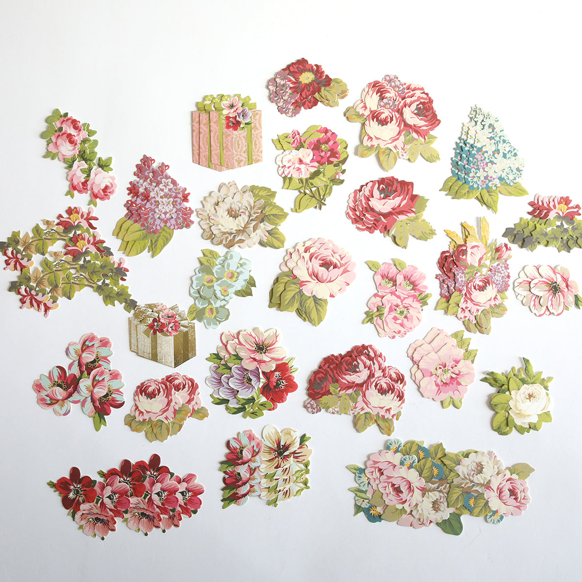 Jasmine Cardstock, Borders & Embellishments features vibrant paper cutouts of flowers and gift boxes crafted from floral and gold foil cardstock, arranged elegantly on a white background.