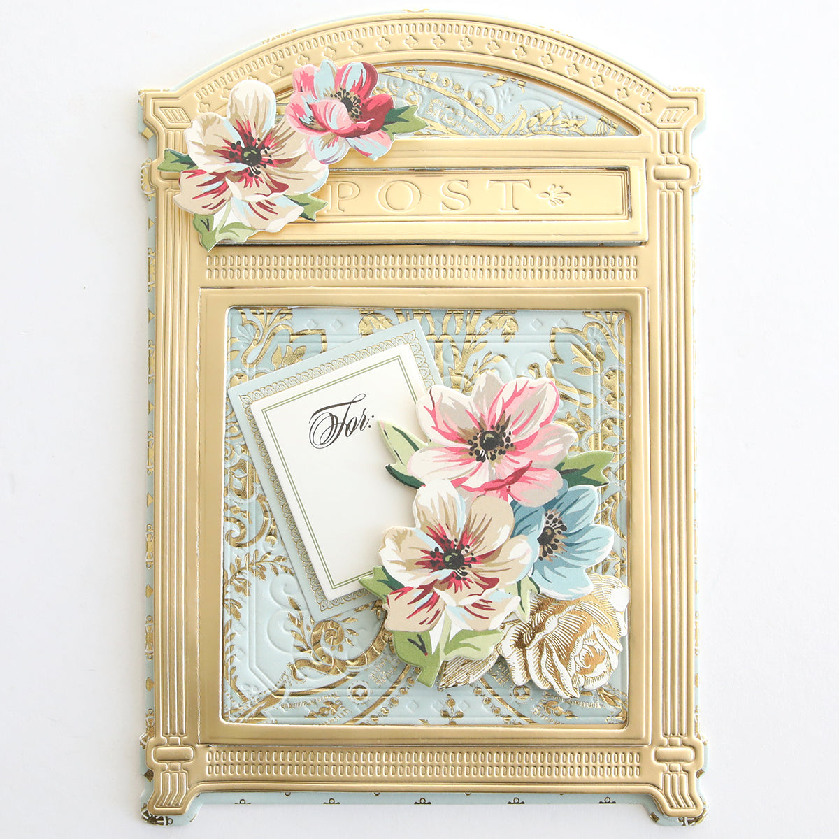 The Create Everyday Embellishments set features a gold and blue card shaped like a vintage mailbox, decorated with die-cut details, layered floral blooms, and finished with a charming "For You" tag.