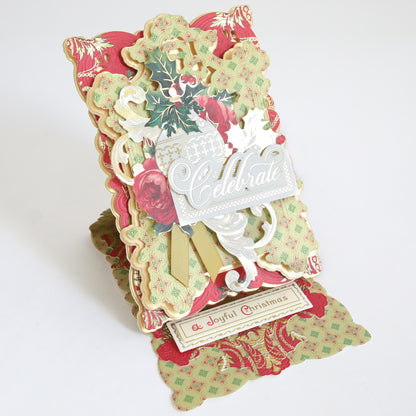Create Holiday Embellishments pop-up card features layered floral patterns, festive accents, the word "Celebrate," and a bottom message: "A Joyful Christmas.