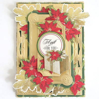 The Create Holiday Embellishments card features a gold frame, festive poinsettias, green foliage, and a gift box with layered die cuts plus "A Gift For You" text in the center.