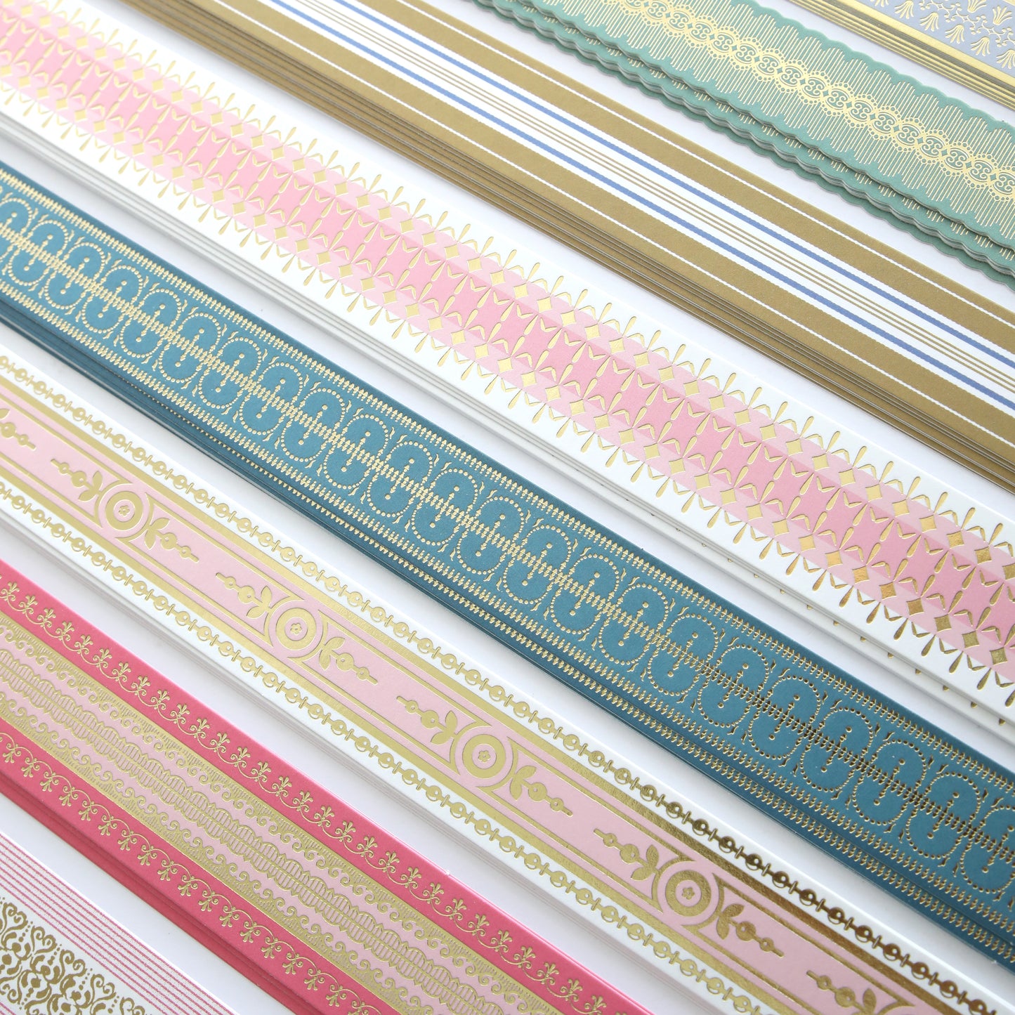 Create Everyday Border Stickers feature intricate gold, pink, blue, and green patterns, ideal for scrapbooks or handmade cards. Sheets are arranged in parallel rows on a white background.