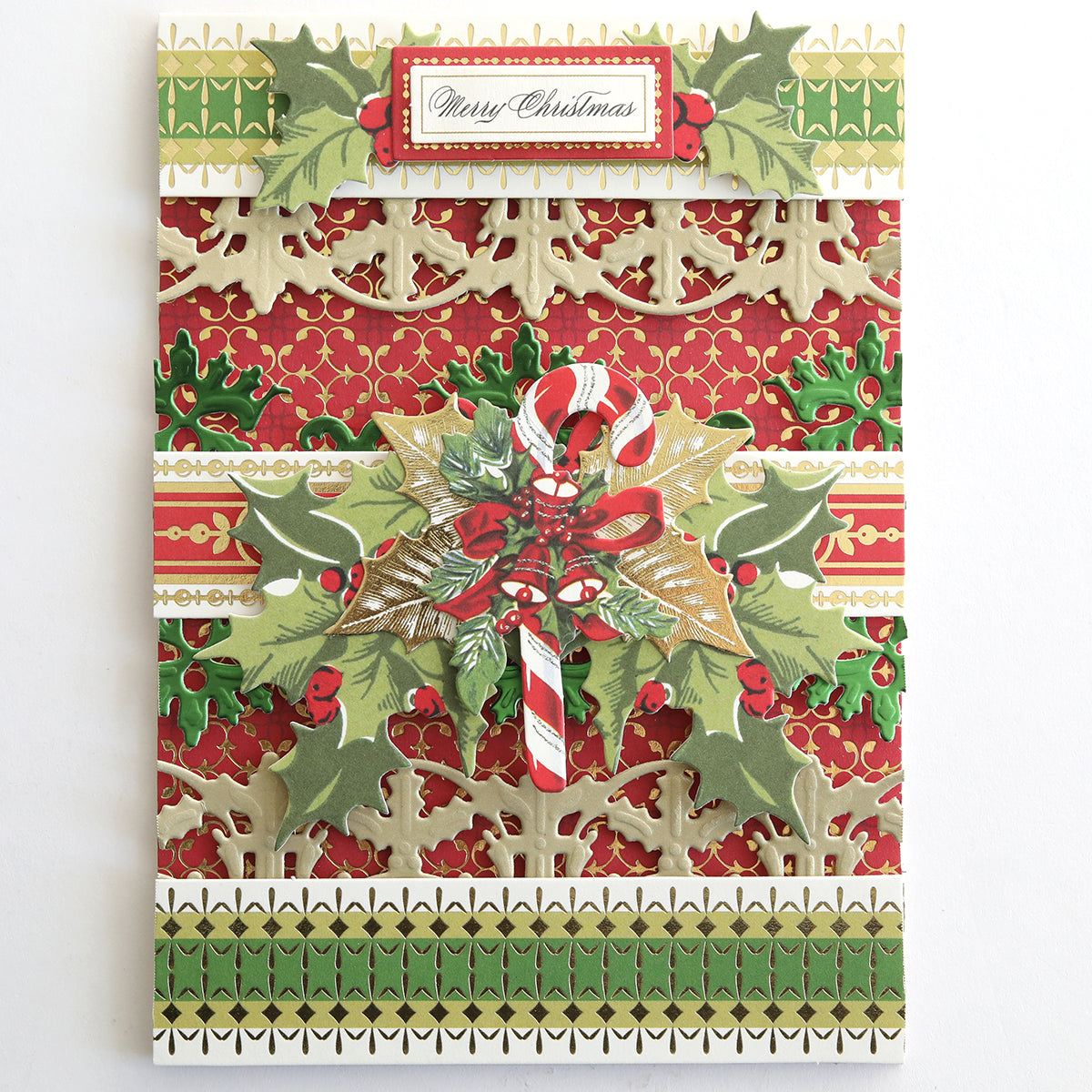 A decorative Christmas card with a "Merry Christmas" label, red and gold patterns, holly leaves, and two candy canes tied with a bow—perfect for festive crafting or pairing with Create Holiday Border Stickers.