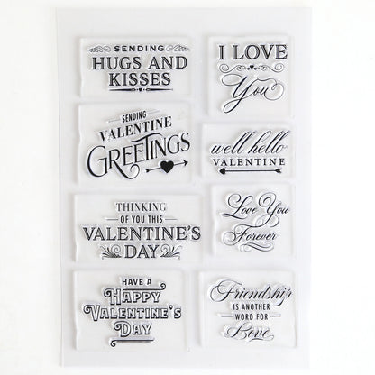 Lovely Sentiment Stamps: a sheet of clear stamps featuring "Hugs and Kisses," "I Love You," and "Valentine Greetings" in decorative fonts—ideal for adding sweet touches to handmade cards or scrapbook pages.