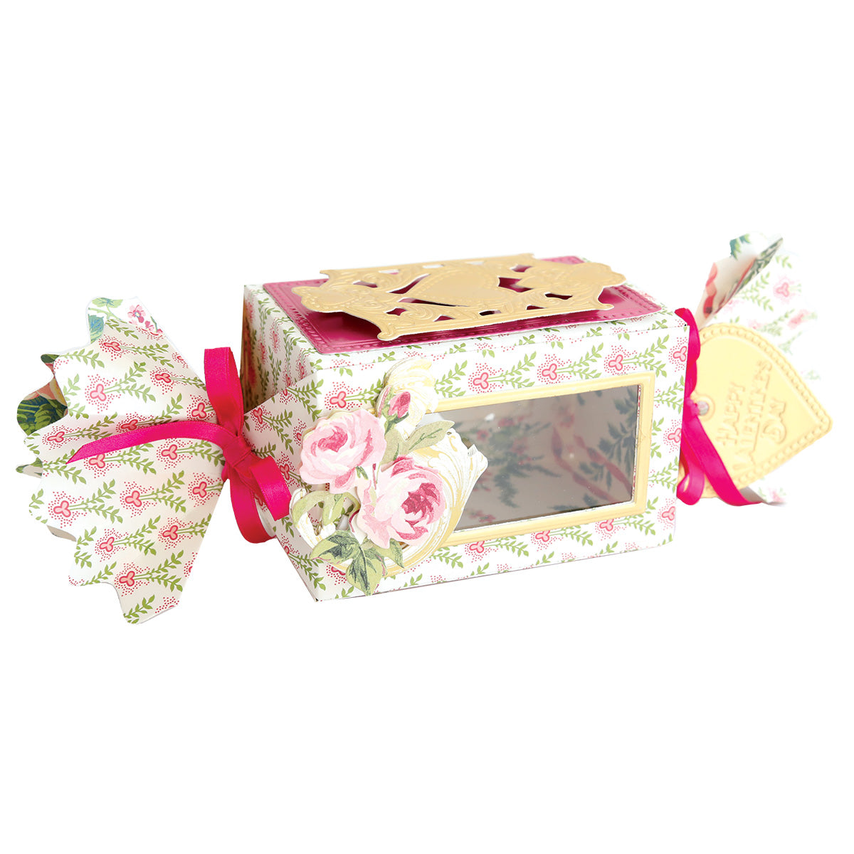 The Candy Wrapper Box Dies creates rectangular floral-patterned gift boxes with pink ribbon, gold top, transparent window, and twisted candy wrapper ends—ideal as treat or favor boxes.