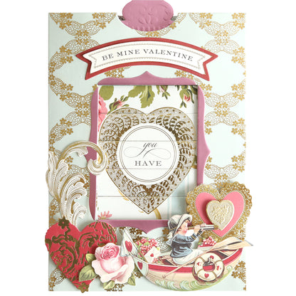 The Valentine Clever Scene Cards feature gold patterns, hearts, flowers, and a vintage couple in a boat, with clever sliding dies for interactive fun. Messages include "Be Mine Valentine" and "You Have My Heart.