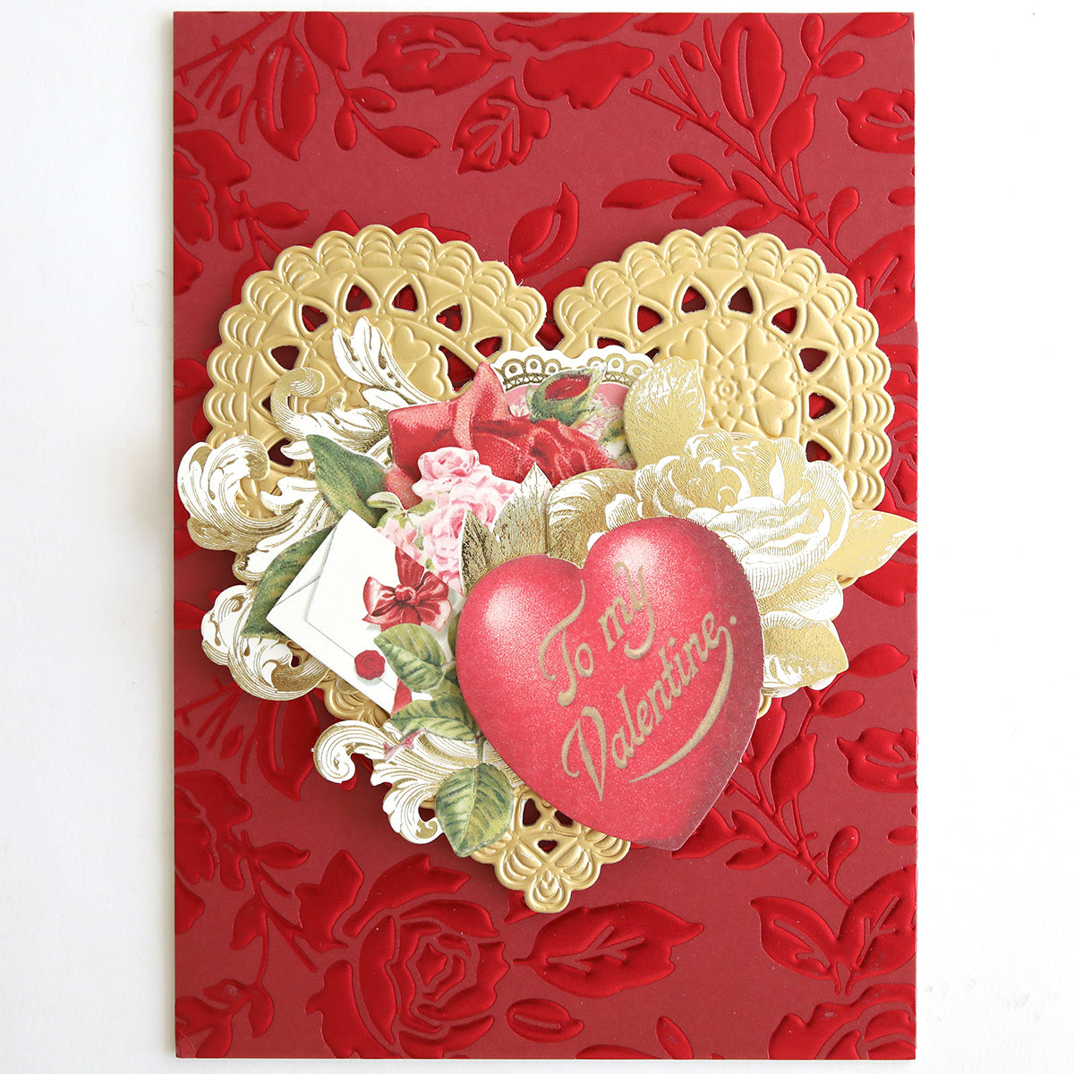 Show your love with Vintage Valentine Die Cut Embellishments—a red embossed card featuring a gold lace heart, floral accents, and a red heart inscribed "To my Valentine" in cursive—ideal for paper crafting or vintage card enthusiasts.