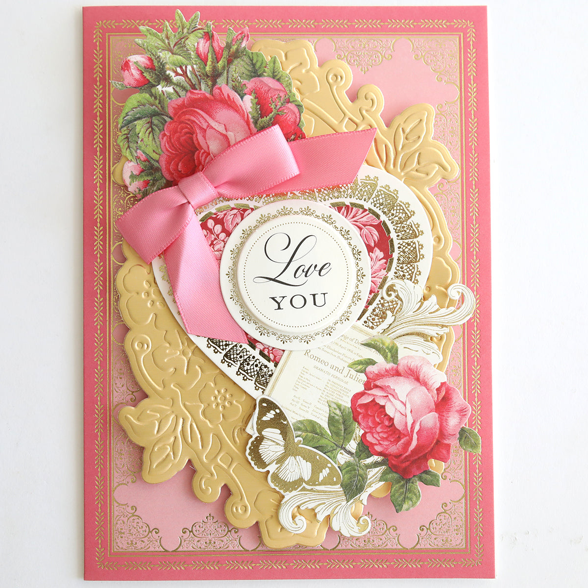 Add a touch of romance with Vintage Valentine Die Cut Embellishments, perfect for decorating pink and gold floral greeting cards featuring ribbon bows and "Love You" labels for unique paper crafting projects.