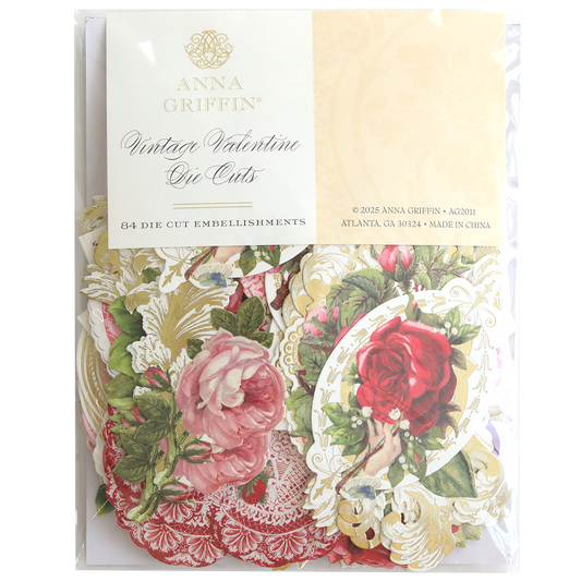 A package of Vintage Valentine Die Cut Embellishments featuring floral and ornate heart designs, ideal for paper crafting projects in red, pink, and gold tones.
