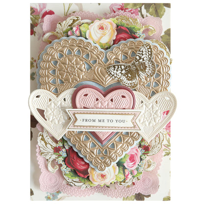 Showcase your Valentine’s crafts with this handmade card featuring layered embossed hearts using 3D Concentric Heart Dies, a butterfly, floral designs, and a "From Me to You" banner—a charming decorative touch for any occasion.