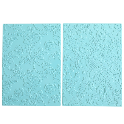 Two rectangular blue silicone mats with intricate floral and leaf patterns, perfect for hot foil and embossing machines or pairing with Gilded Floral Hot Foil Plates to add stunning foil to your cardstock creations.