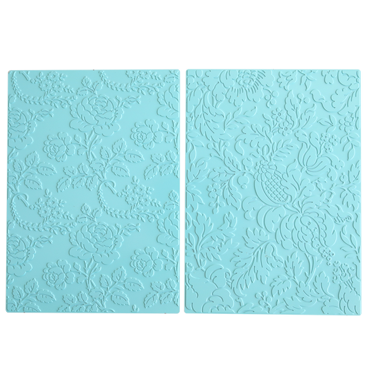 Two rectangular blue silicone mats with intricate floral and leaf patterns, perfect for hot foil and embossing machines or pairing with Gilded Floral Hot Foil Plates to add stunning foil to your cardstock creations.