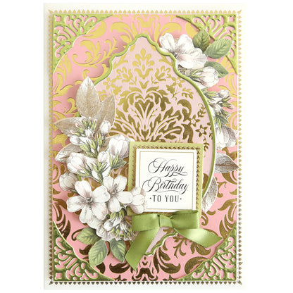 Birthday card made with Gilded Damask Hot Foil Plates, showcasing gold and pink embossed designs, white flowers, green leaves, a green bow, and the "Happy Birthday to you!" message in the center.