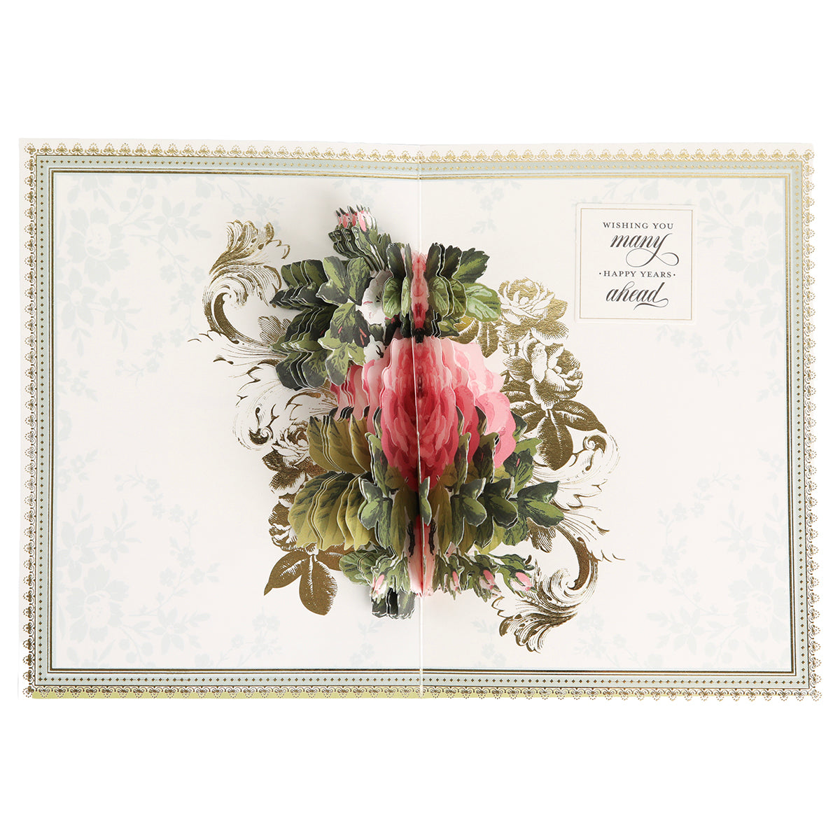 The Folded Rose Card Making Kit includes an open greeting card featuring a three-dimensional pink flower with green leaves as the centerpiece, gold decorative accents, and the message "Wishing you many happy years ahead." Ideal for showcasing your favorite 3D embellishments or for use with a floral card making kit, this set brings elegance and charm to any special occasion.