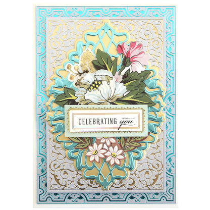 A decorative greeting card with ornate blue and gold patterns, florals, and "Celebrating you" text—crafted using Gilded Ironwork Frames Hot Foil Plates for a luxurious finish.