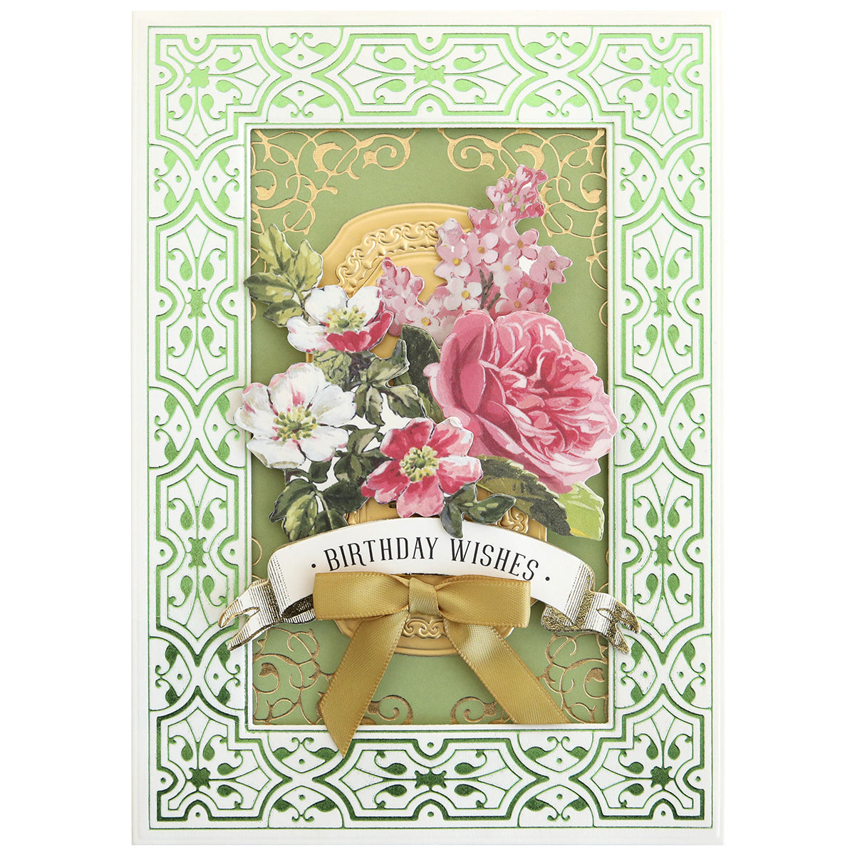A greeting card with "Birthday Wishes," pink and white flowers, gold accents made with Gilded Ironwork Frames Hot Foil Plates, and a gold ribbon on a green decorative background.