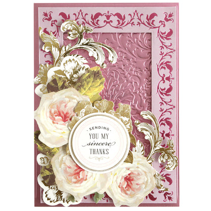 Show your gratitude in style with the Rose and Pineapple Gilded Hot Foil Plates, paired with Perfect Palette Pastel Hot Foil. This decorative card features embossed pink patterns, white and pink roses, gold accents, and a round label reading “Sending you my sincere thanks.” Subtle pastel hot foil details lend an elegant touch—perfect for fans of gilded crafts.