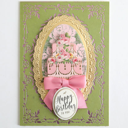 The Perfect Palette Pastel Gild Hot Foil card features ornate gold and pink floral designs, a pink ribbon, a decorated birthday cake, and "Happy Birthday To You" on the front—ideal for sophisticated paper crafts.