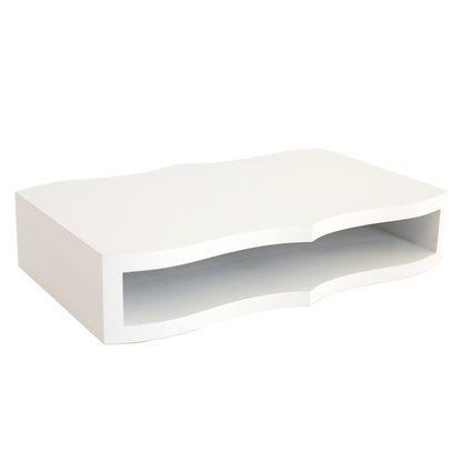 The Empress Mini Lazy Susan, a white rectangular floating wall shelf with a wavy open front and smooth finish, offers elegant crafting storage—perfect for organizing your supplies—shown against a plain white background.