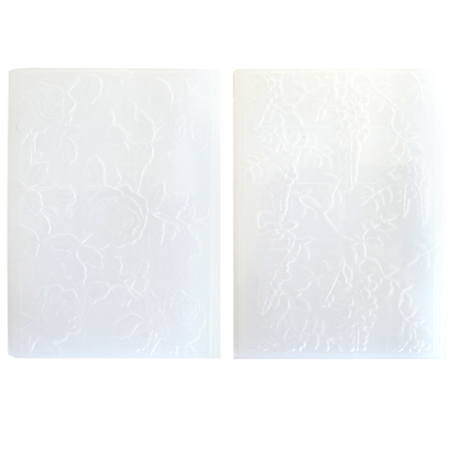 Two translucent white Trellis and Pergola 3D Embossing Folders, each with a unique floral design, are shown side by side on a plain background.