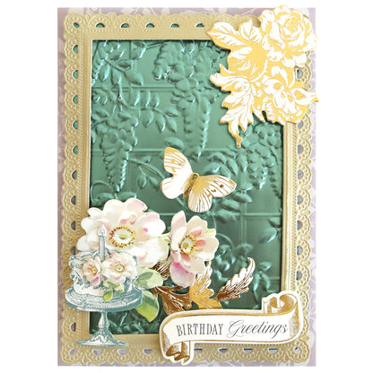 Birthday card featuring a green embossed background made with 3D Embossing Folders and Plates, gold floral accents, a gold butterfly, cake and flowers, finished with a "Birthday Greetings" banner at the bottom.