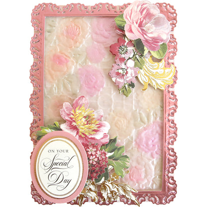 A rectangular card made with Garden Gate and Pavilion 3D Embossing Folders, featuring an embossed floral pattern, paper flowers, and an oval label that reads “On Your Special Day.”