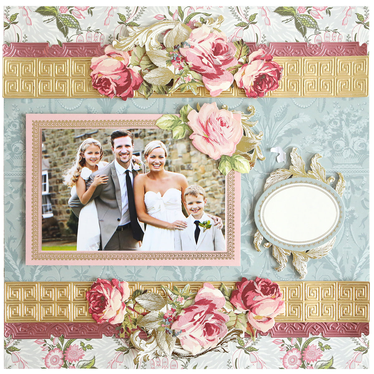 A scrapbook page with a family portrait of two adults and two children, adorned with pink florals and dimensional borders made using Geometric 3D 12" Border Dies—an ideal touch for your paper crafting projects.