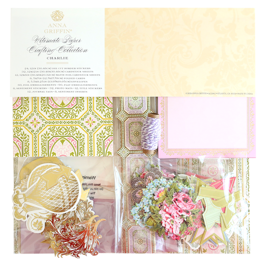 Charlie Ultimate Paper Crafting Collection featuring patterned papers, decorative cardstock, twine, and floral embellishments—perfectly organized for creating stunning layered paper crafts.